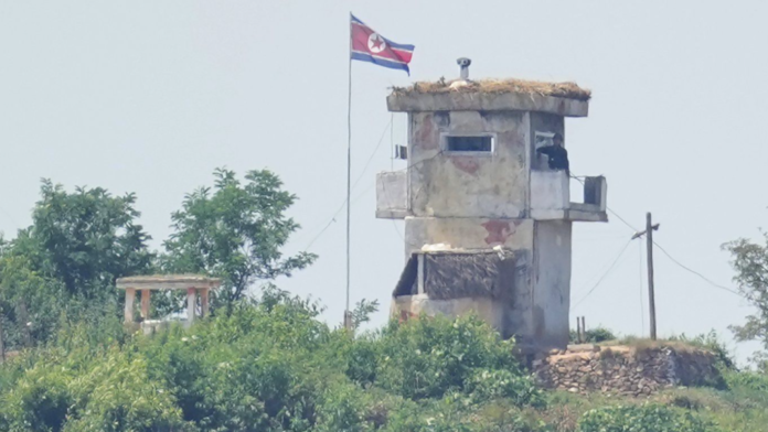 A North Korean soldier stands at the North's military guard post, seen from Paju, South Korea, Wednesday, June 26, 2024. (AP Photo/Lee Jin-man)
