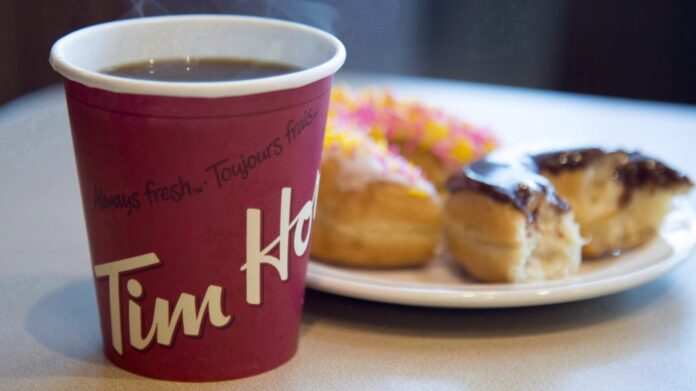 A coffee and doughnut from Tim Hortons is seen at a Coquitlam, B.C., location on April 26, 2018. THE CANADIAN PRESS/Jonathan Hayward